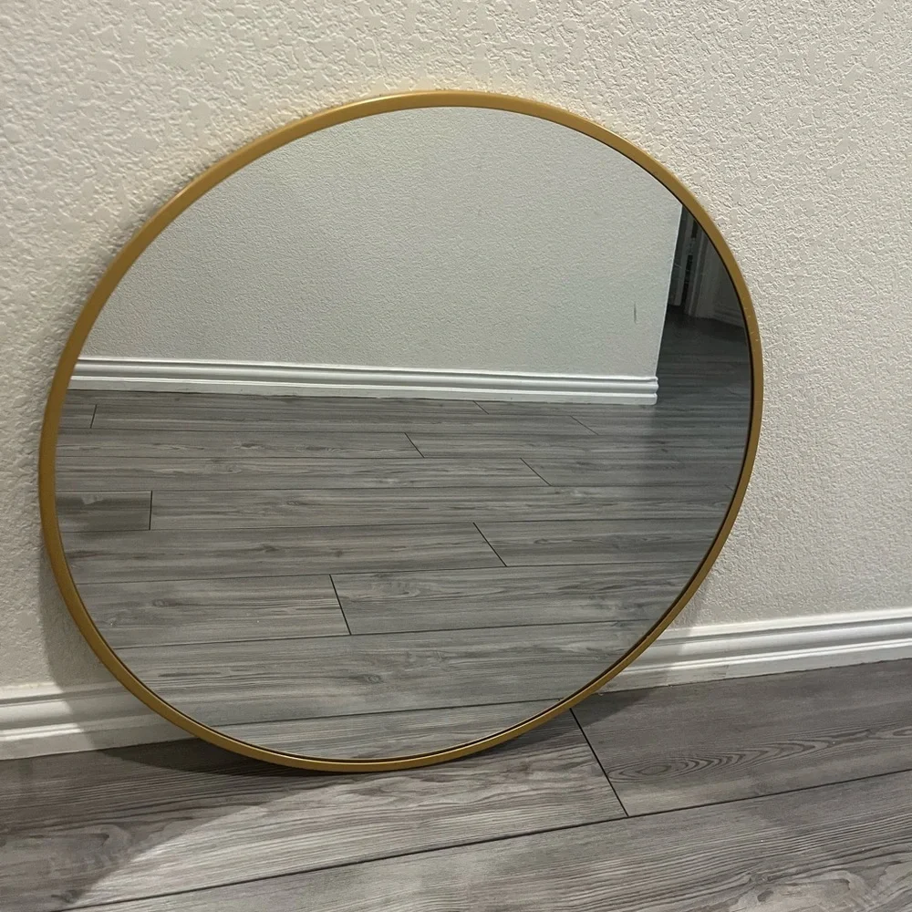 Gold round mirror